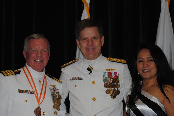 Rear Adm. David Simpson, USN (l), congratulates Capt. Gerry Slevin, USN, chapter president, who is joined by his wife Ruby, at the captain's retirement ceremony held at MacDill Air Force Base in Tampa, Florida, in June.